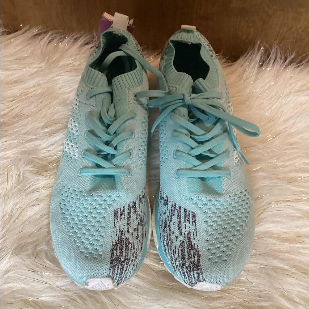 Blue Adidas running shoes